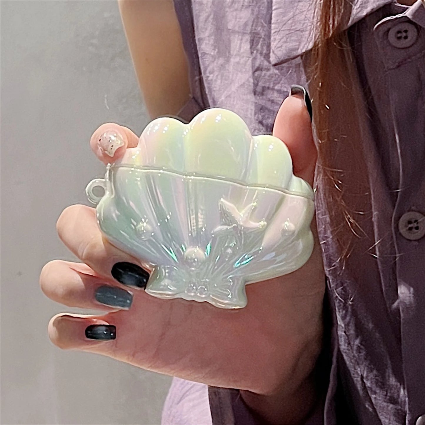 Funda protectora para AirPods diseño de concha marina
